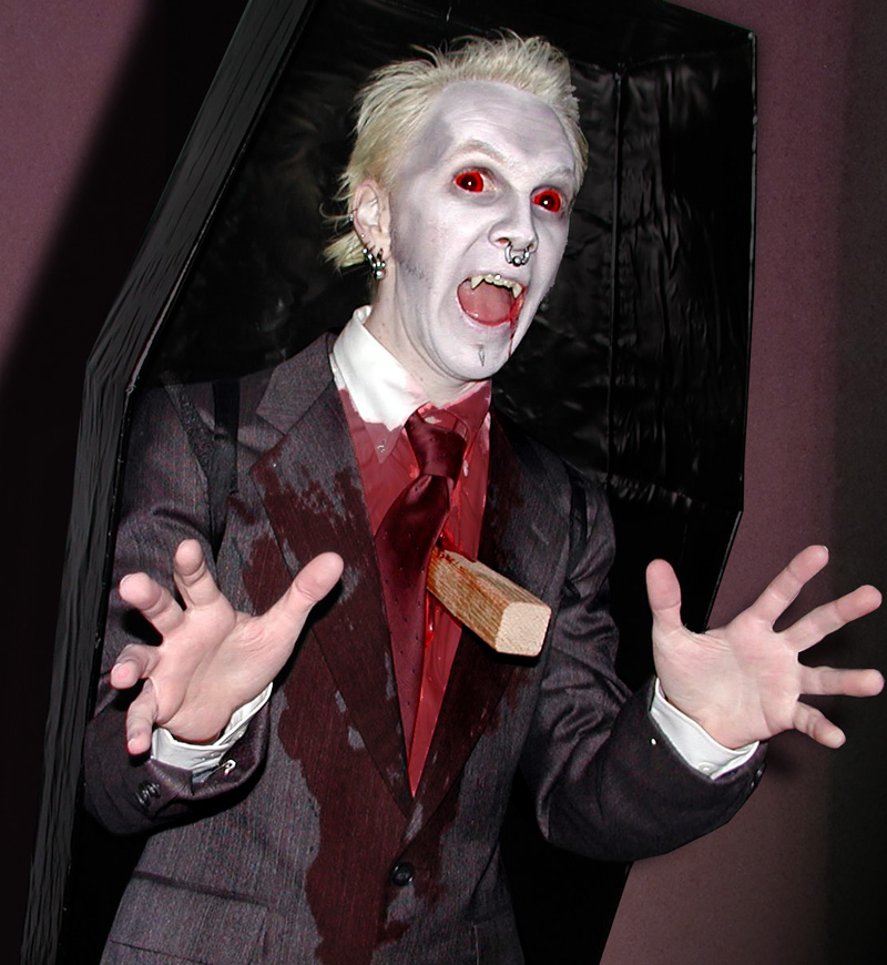 Vampire in coffin Halloween costume.