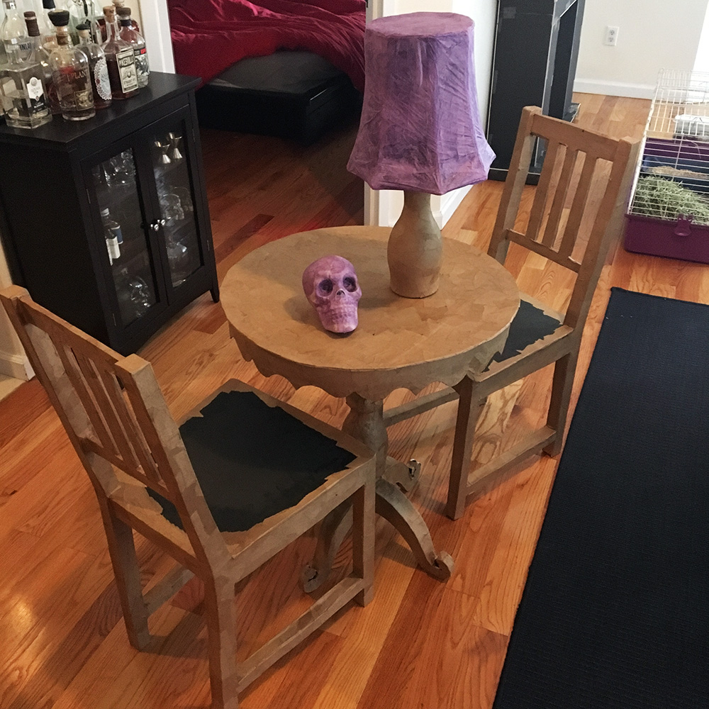 Paper mache chairs, table, and lamp
