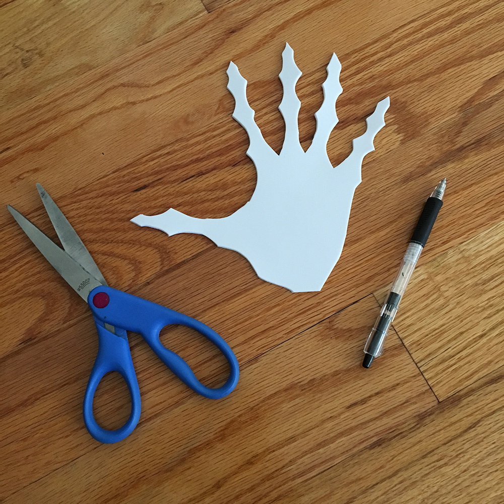 Paper mache ghost hands - tracing and cutting