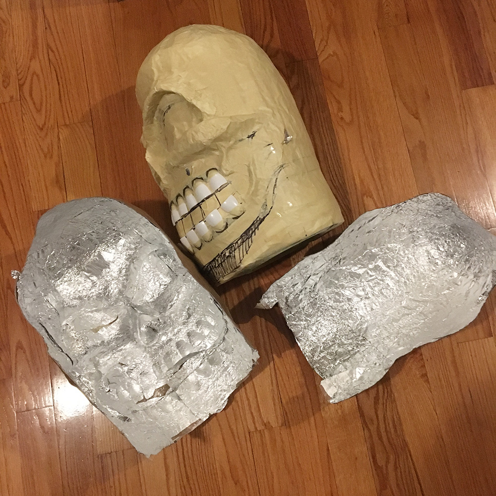 Twin paper mache skull masks - interior view