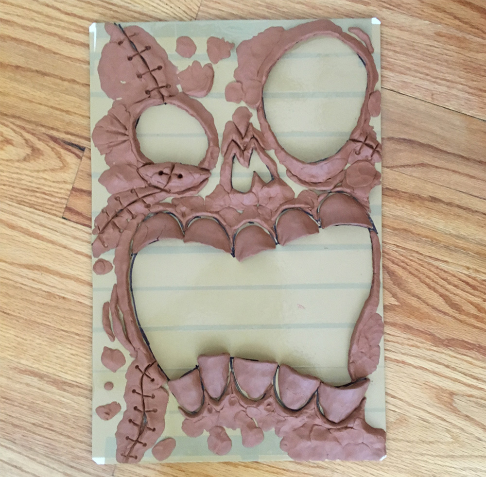 Haunted book sculpture - sculpting the face with clay