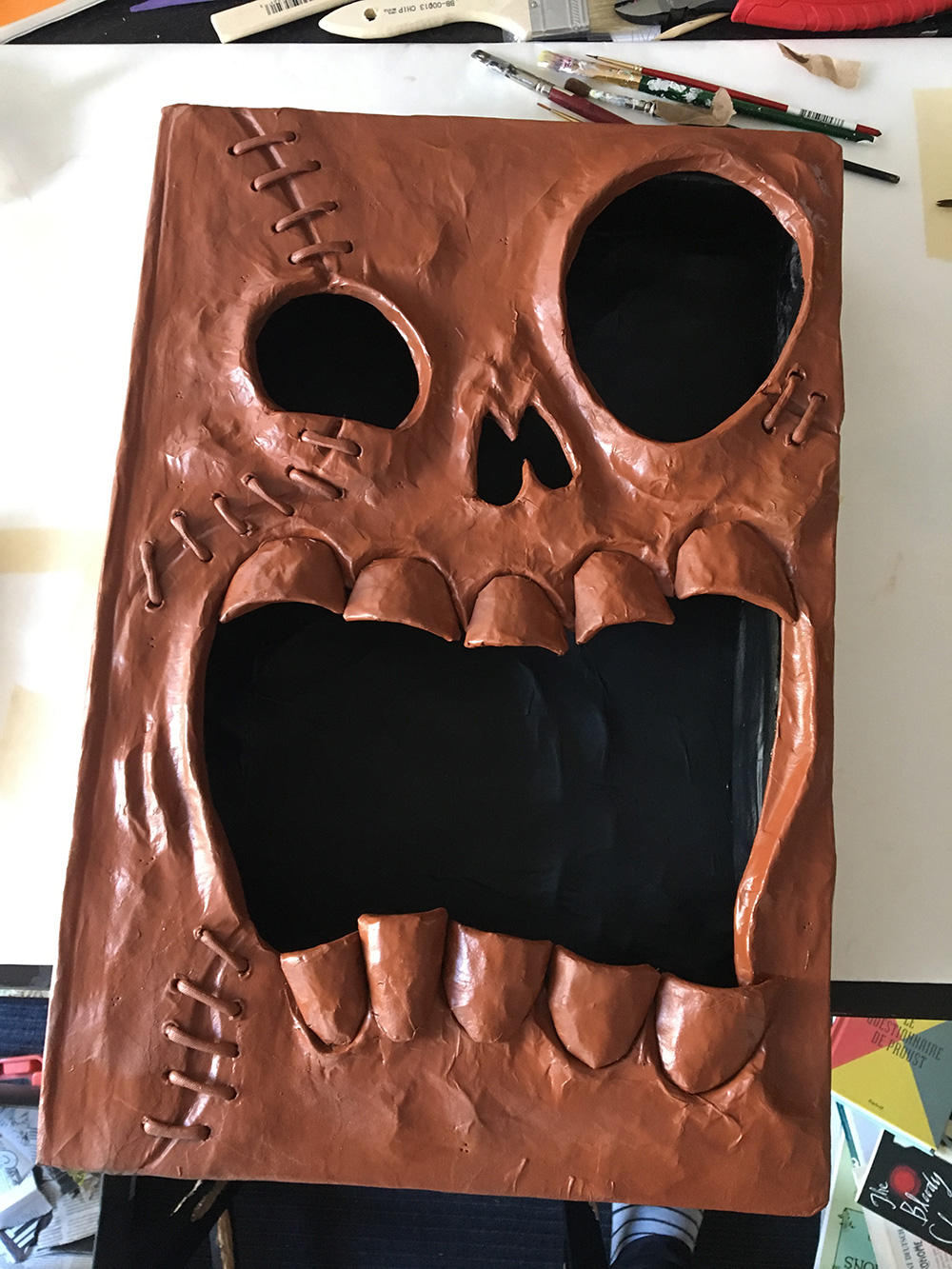 Haunted book sculpture - spray paint background color