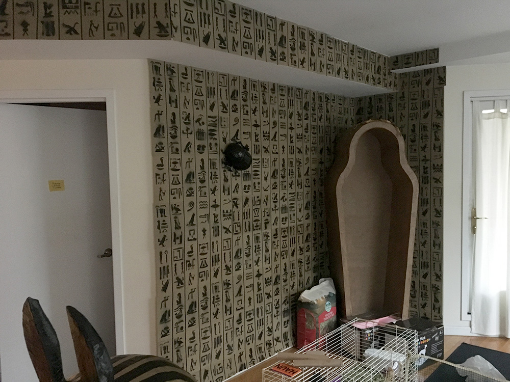 Egyptian hieroglyphs wall decoration - day time view of apartment