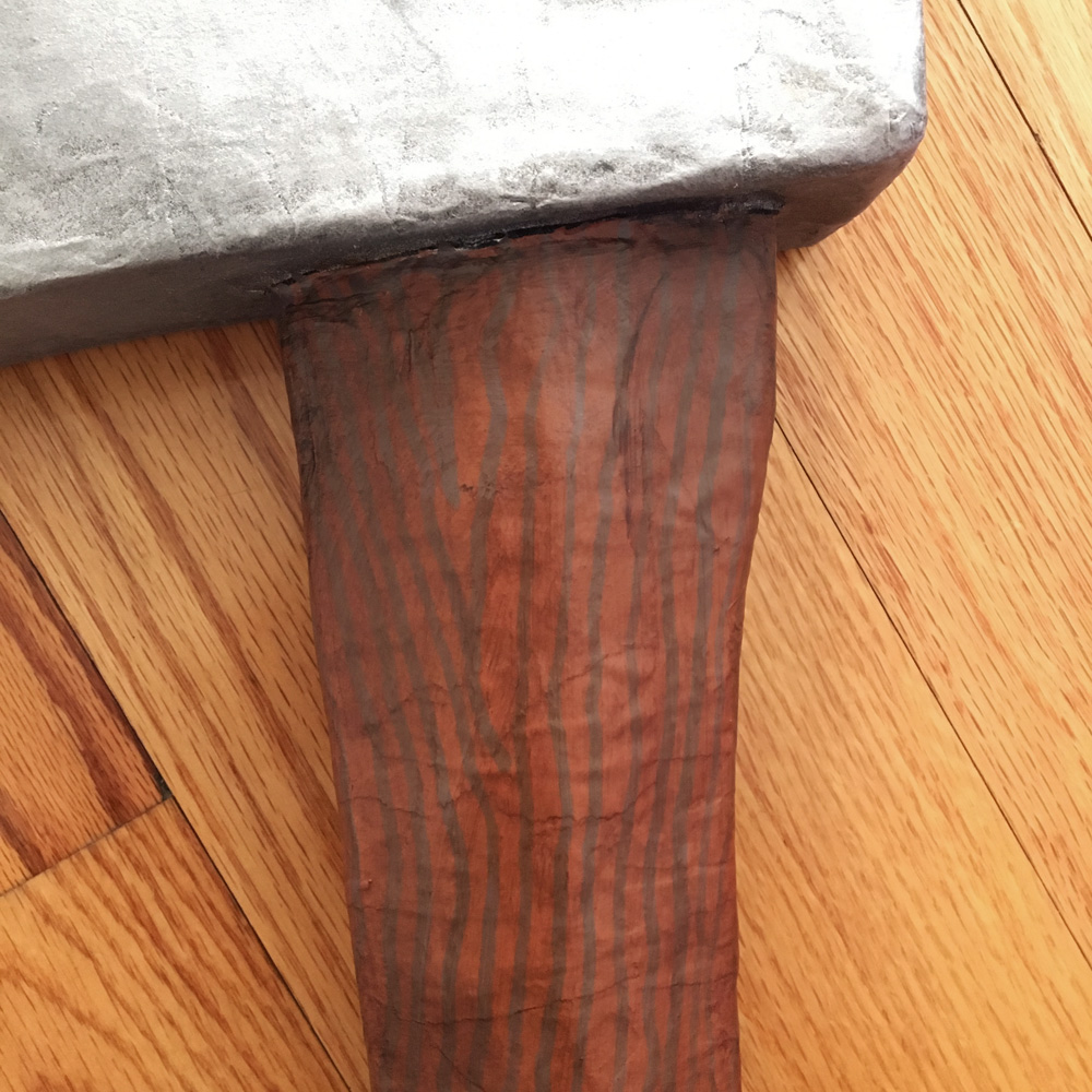 Paper mache axe - hand-painted wood effect on the handle