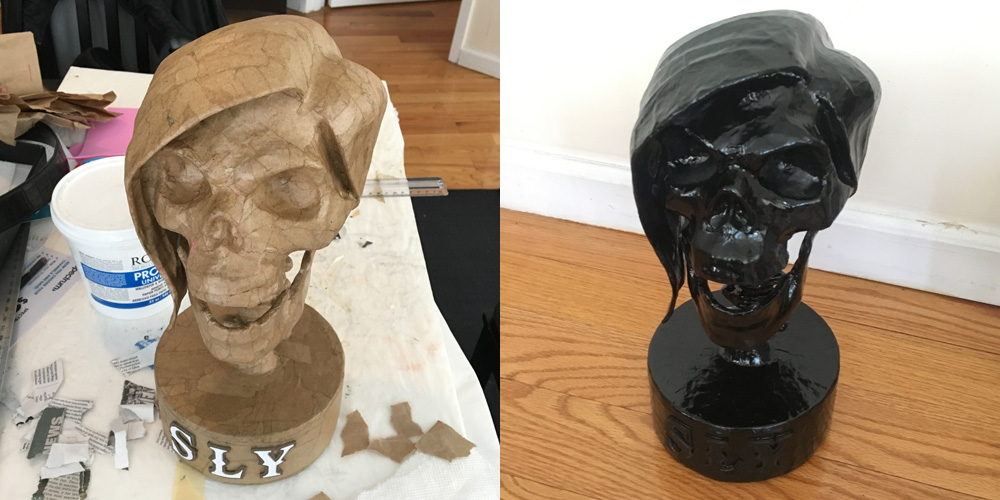 SLY skull sculpture - black spray paint