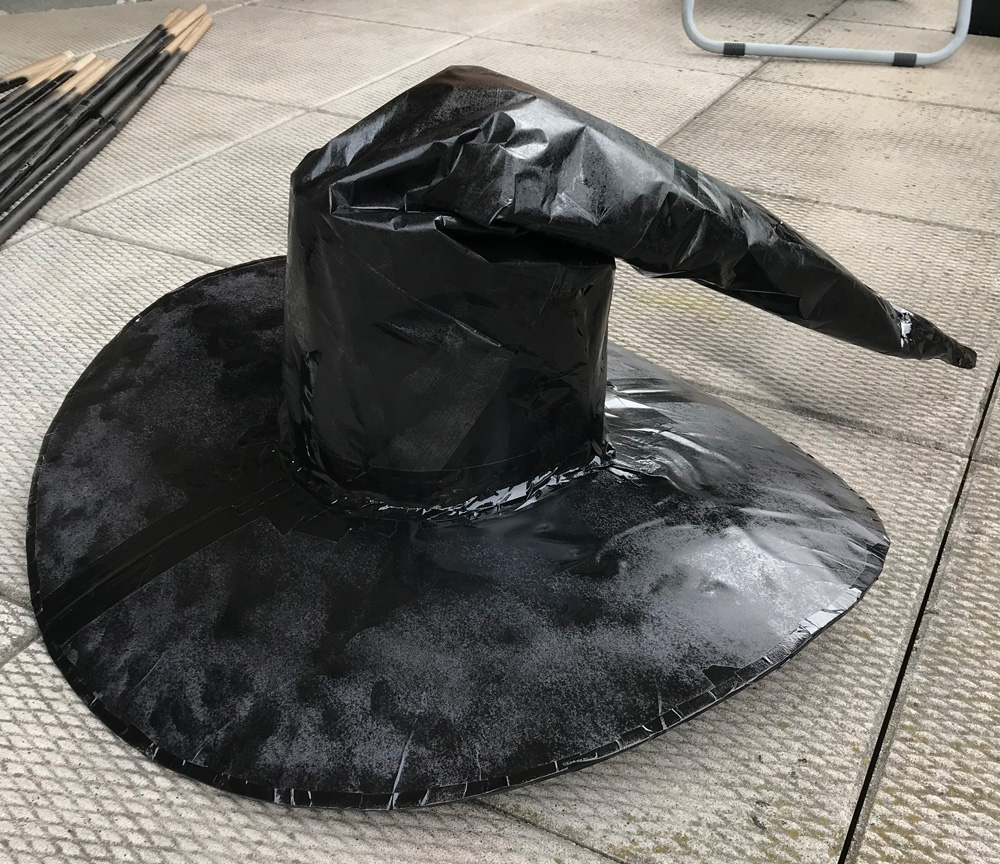 Giant witch statue - painting the hat
