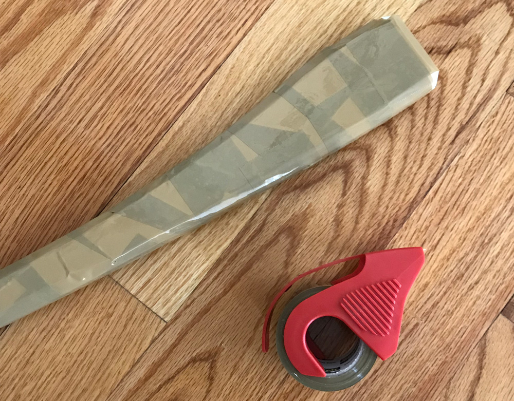Paper mache axe - shipping tape on the handle