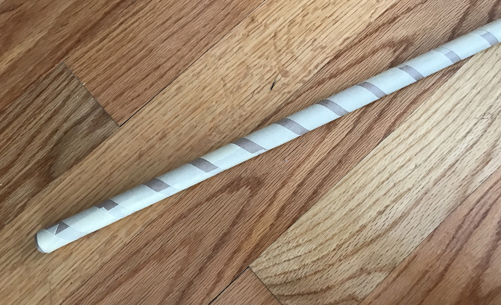 Paper mache rifle prop - rolled up paper for barrel