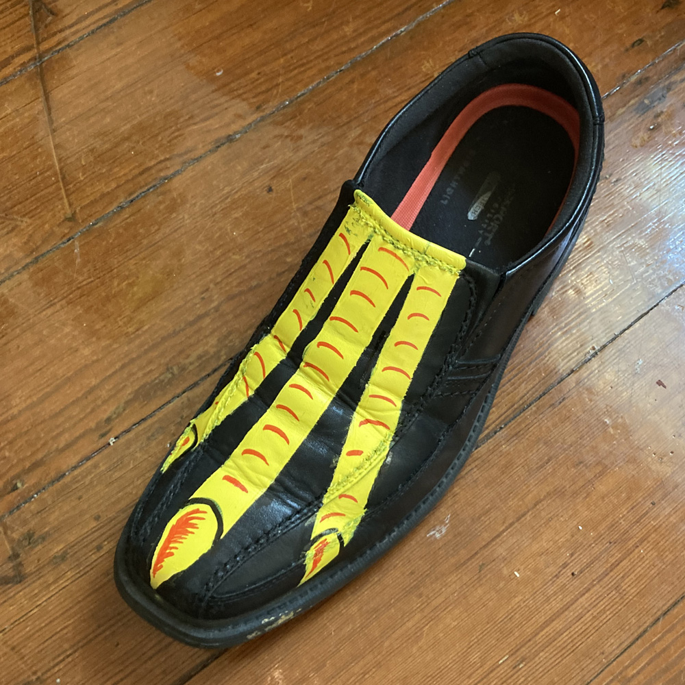Rooster Man costume - painting a chicken foot on one shoe