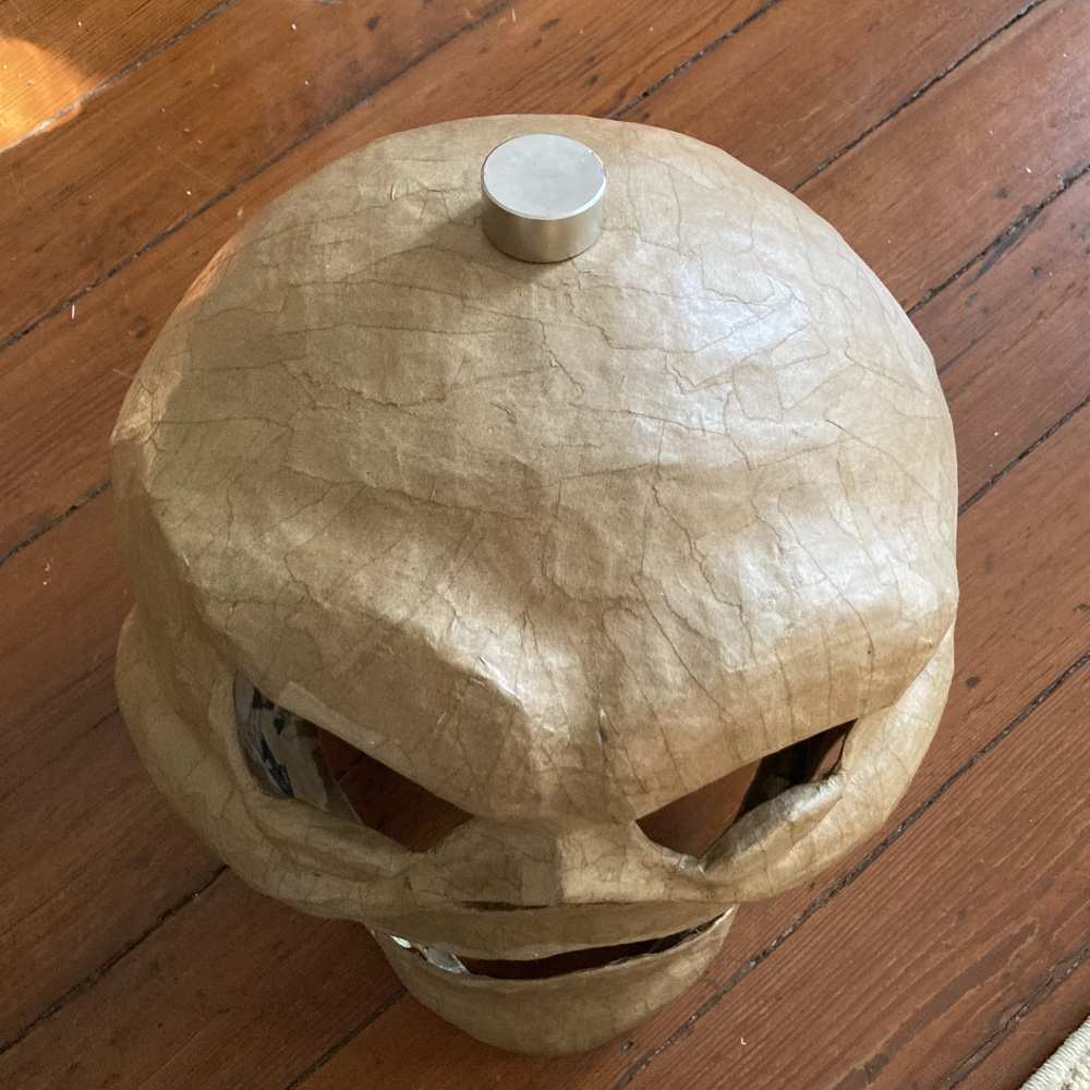 Pro wrestler skeleton costume - magnet to hold hard hat in place