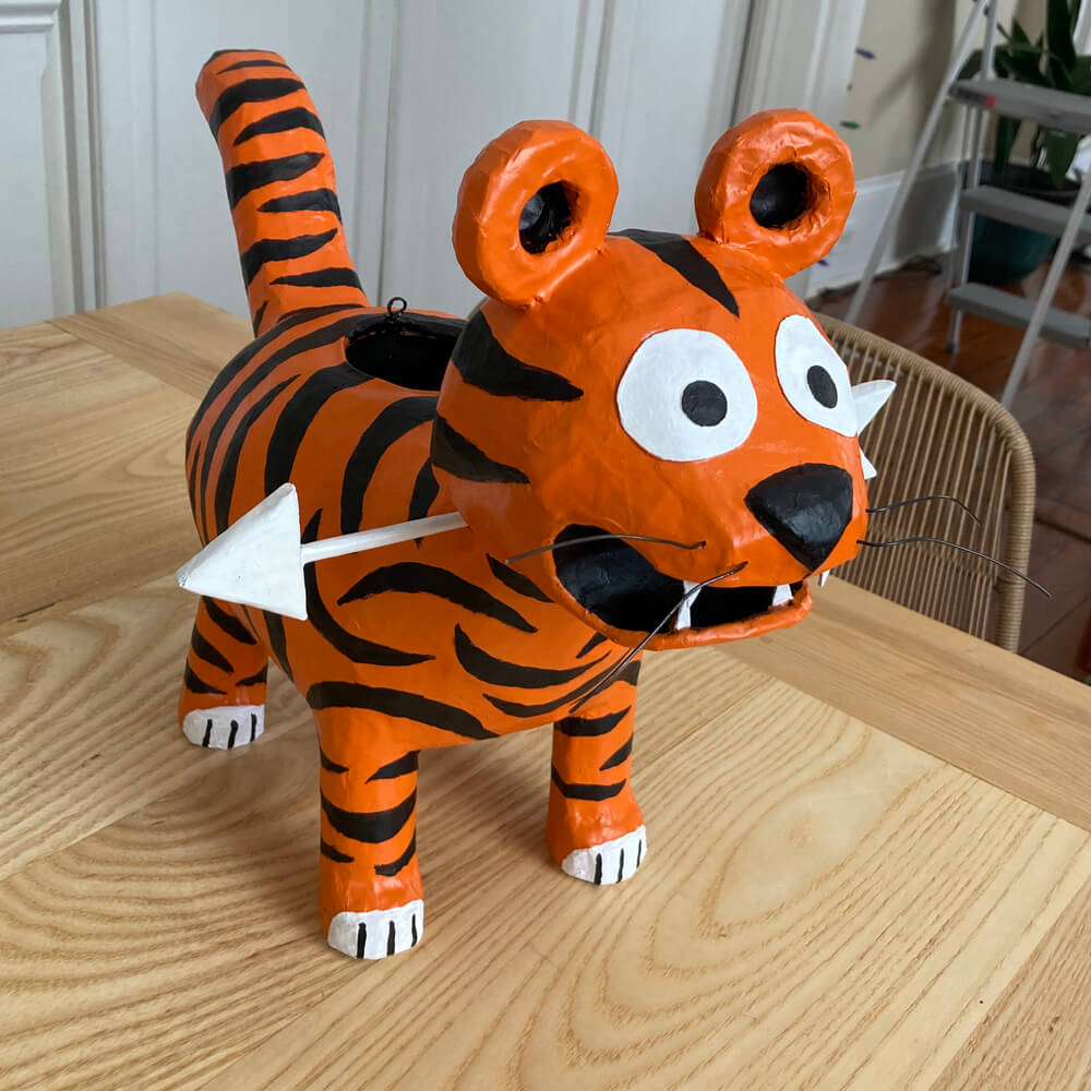 Tiger pinata sculpture - painting the stripes