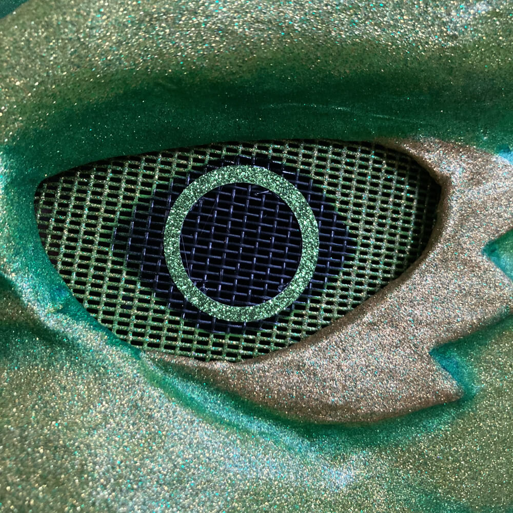 Close up of eye with screen and glittery paper ring