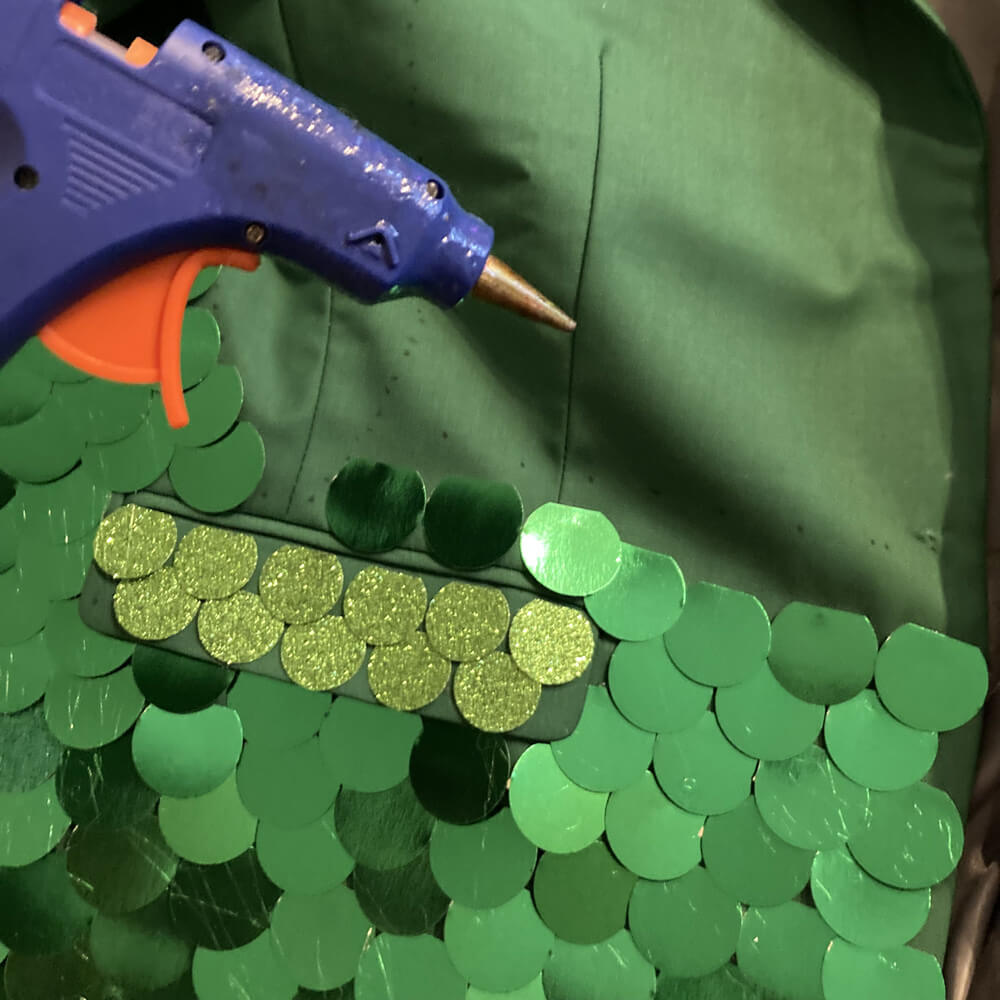 Gluing metallic scales onto my green suit