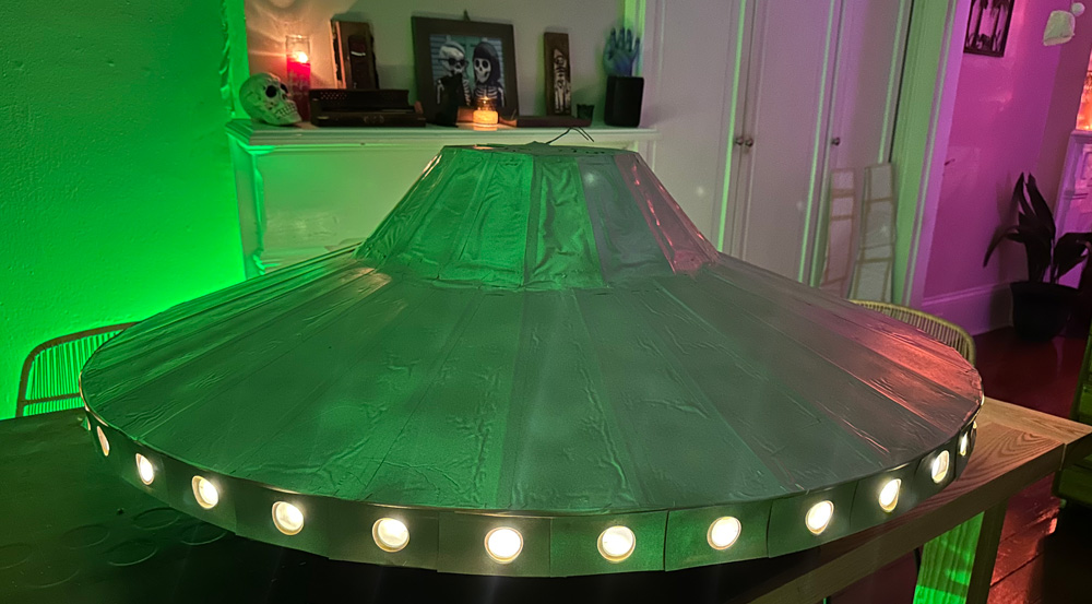 The completed UFO, lit up, on my kitchen table