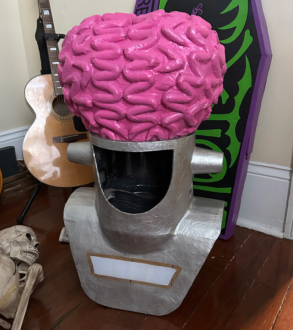 The alien mask, spray painted pink and silver