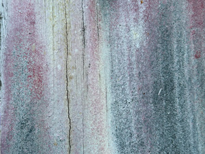 Old wood with paint mostly weathered away