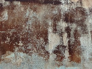 Rough weathered paint roller texture on concrete