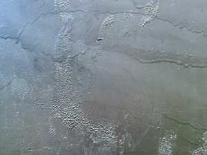 Silver paint over several layers of scraped and dripping paint