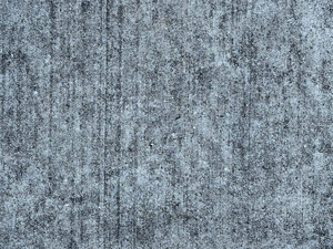 Striations in cement, like it was brushed with some sort of tool to smooth it out