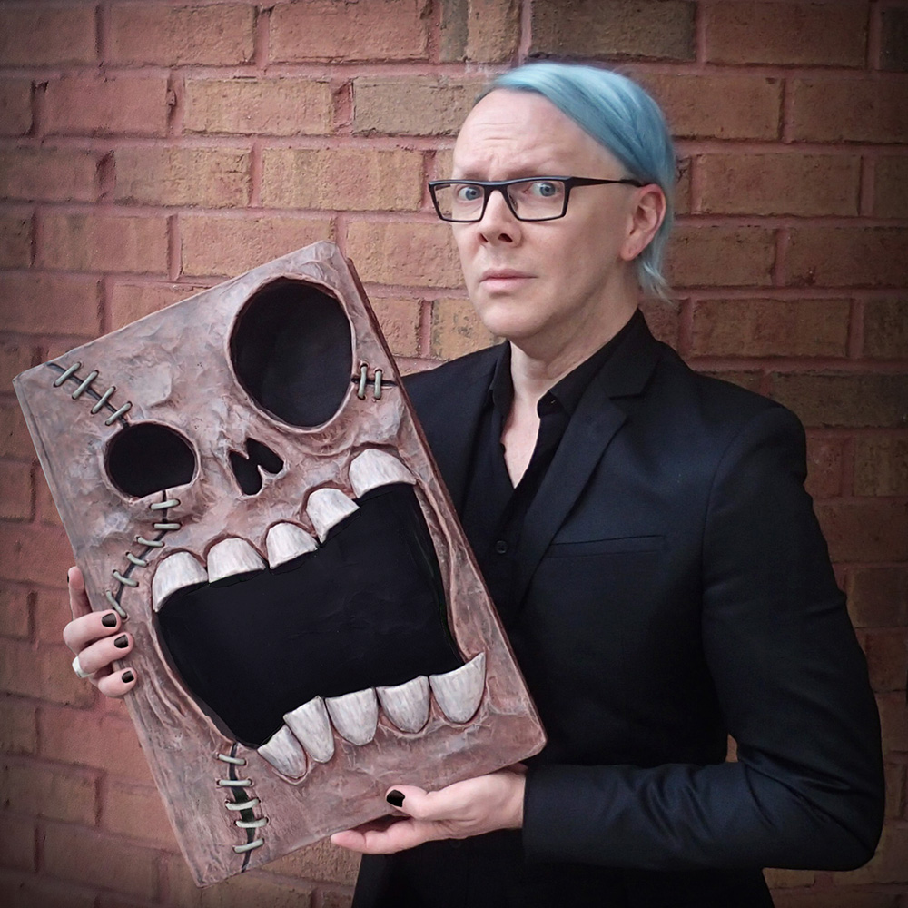 Manning Krull with Necronomicon sculpture