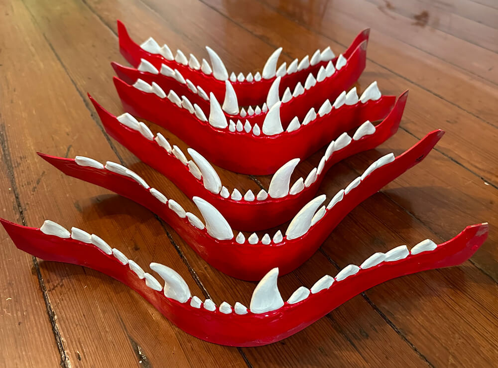 painting all six sets of teeth