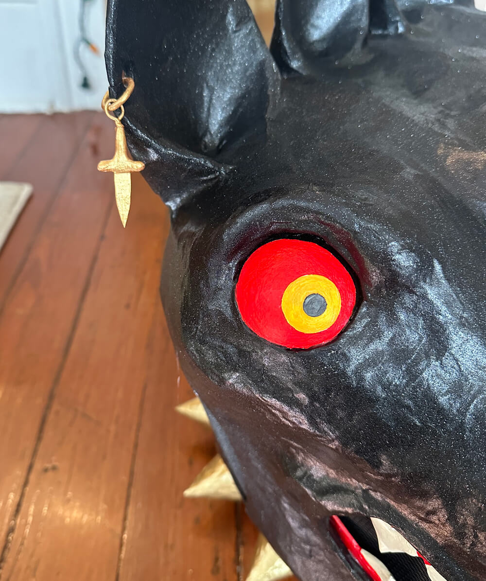 close up of the painted eye and earring