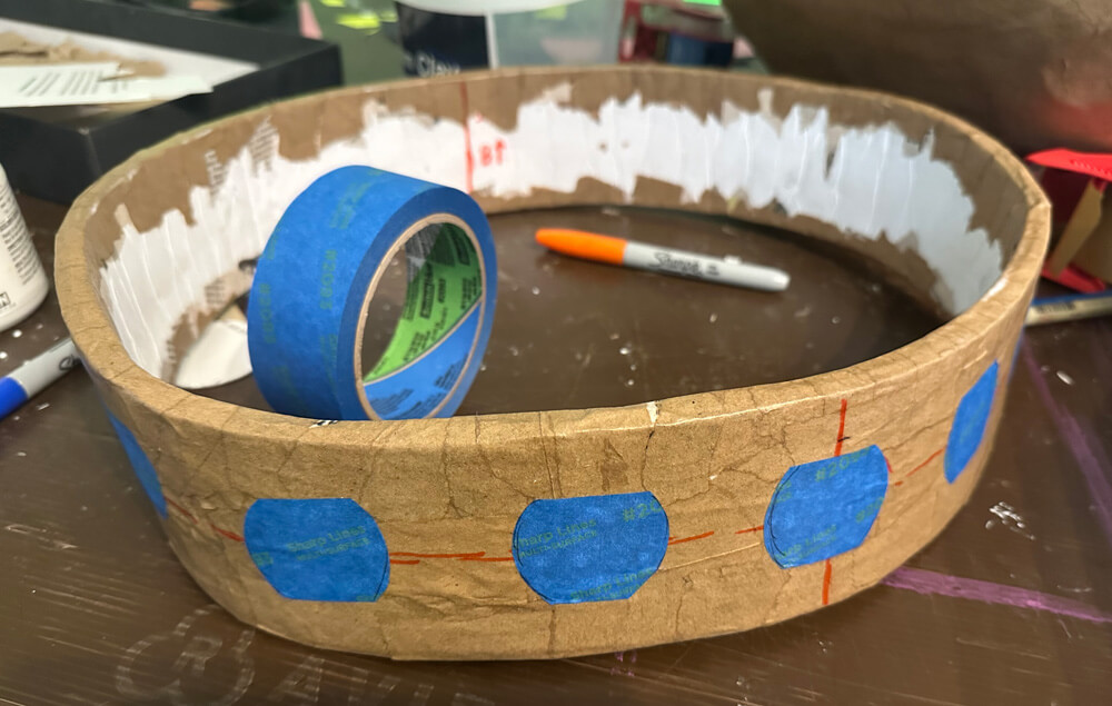 circles of painters tape on the collar