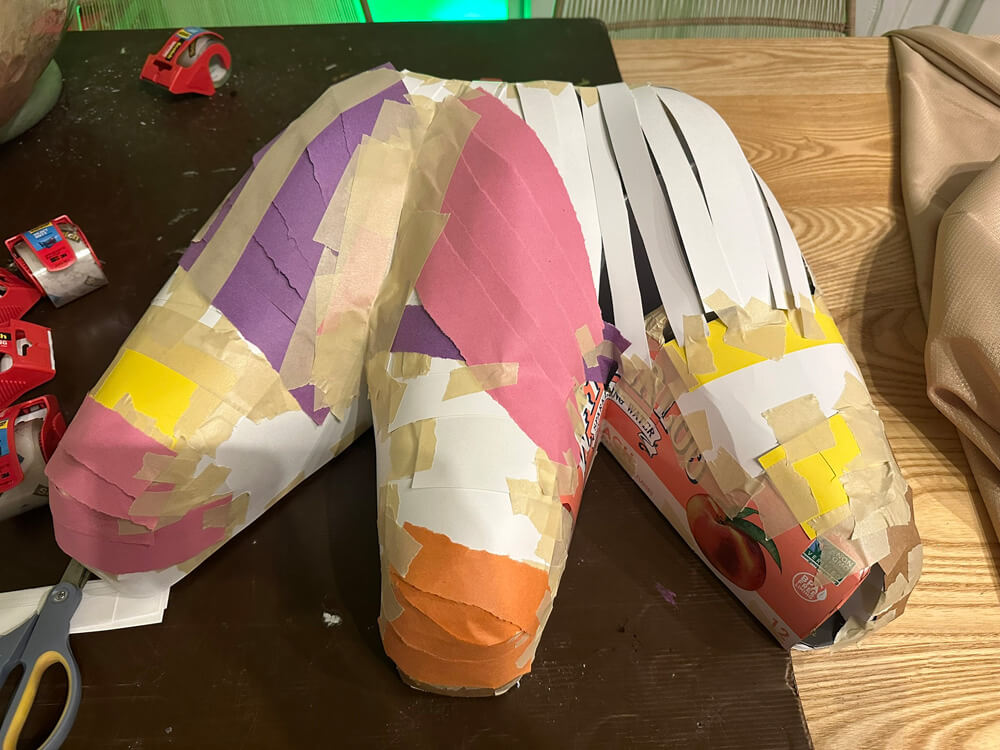 Covering the base with strips of paper and tape