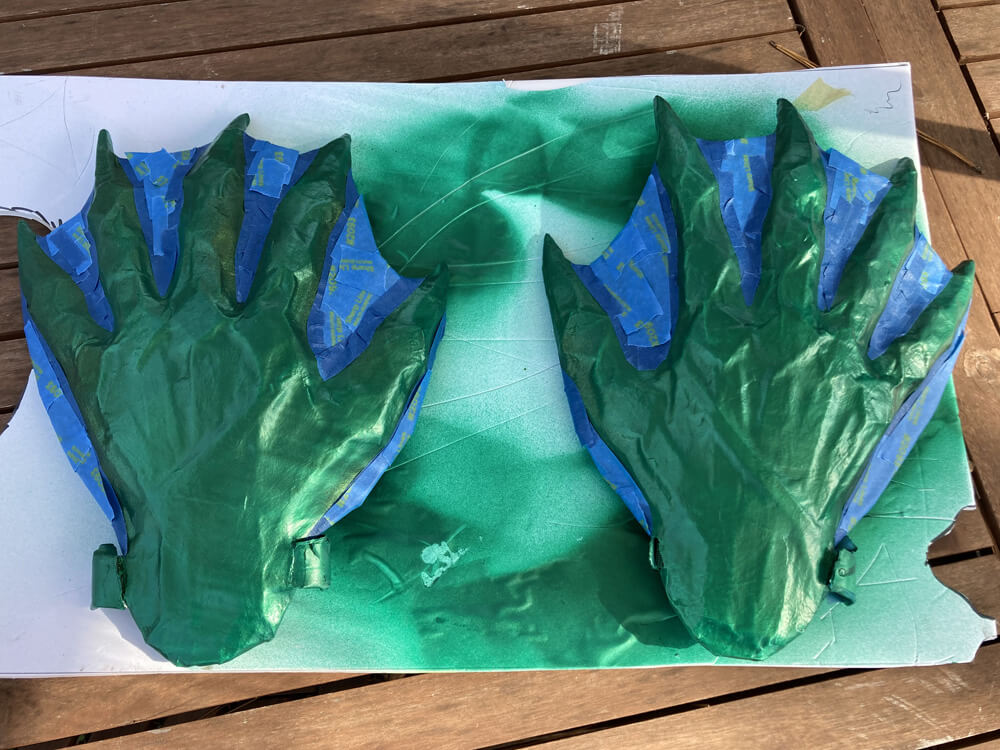 Painter's tape masking out the fins between the fingers