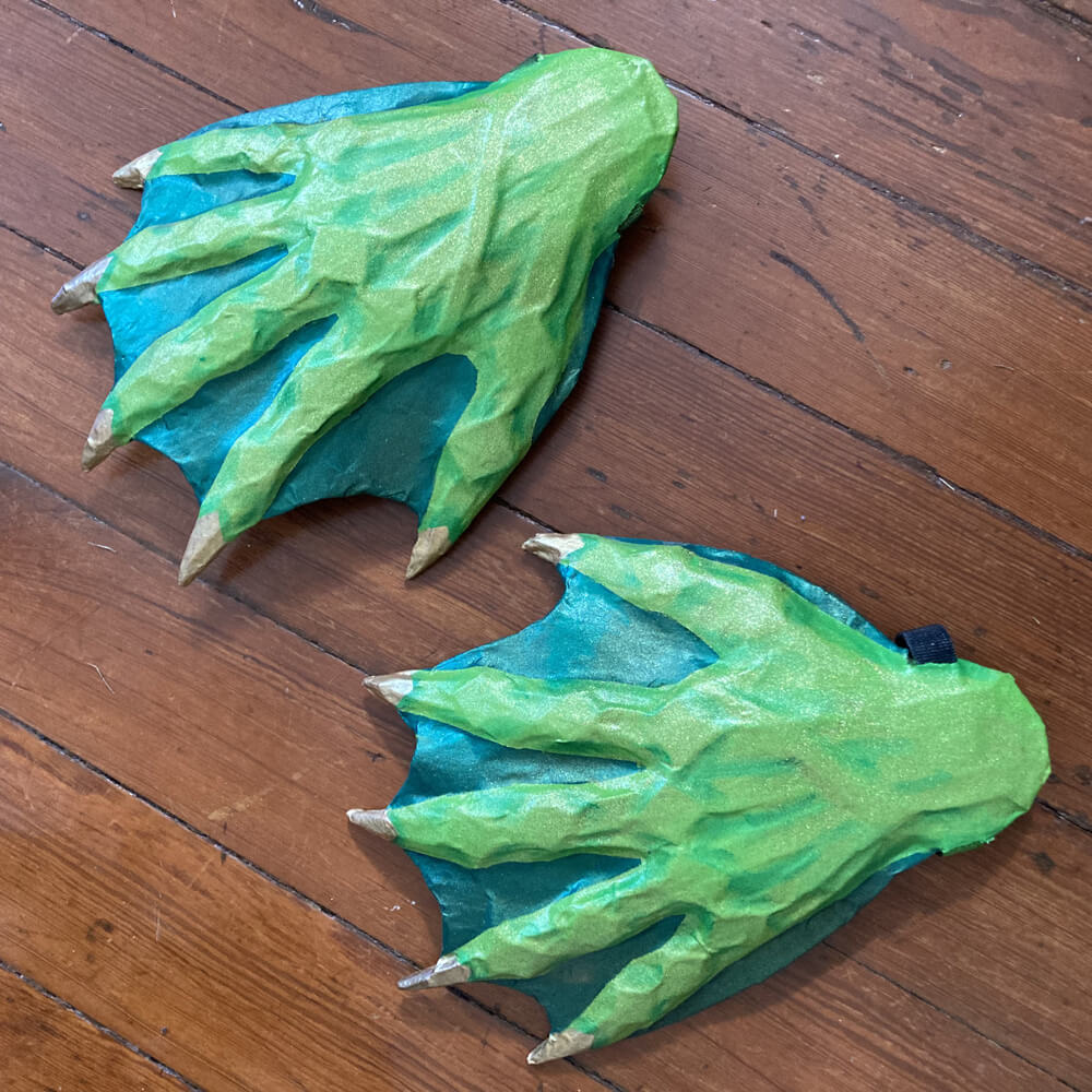 Adding darker green shading on the back of the hands