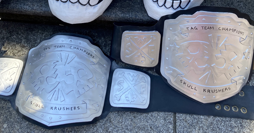 Pro wrestling belt prop - tag team belts on Mardi Gras day