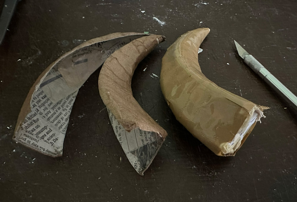 Cutting open the paper mach&eacute; horns
