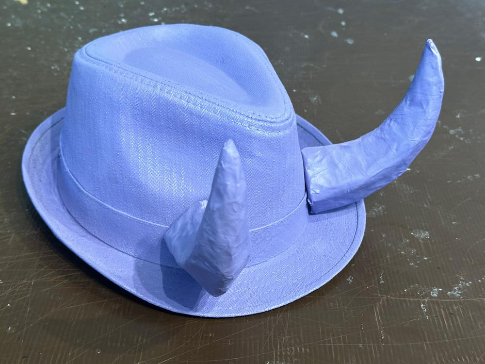 Purple horns mounted on a purple hat