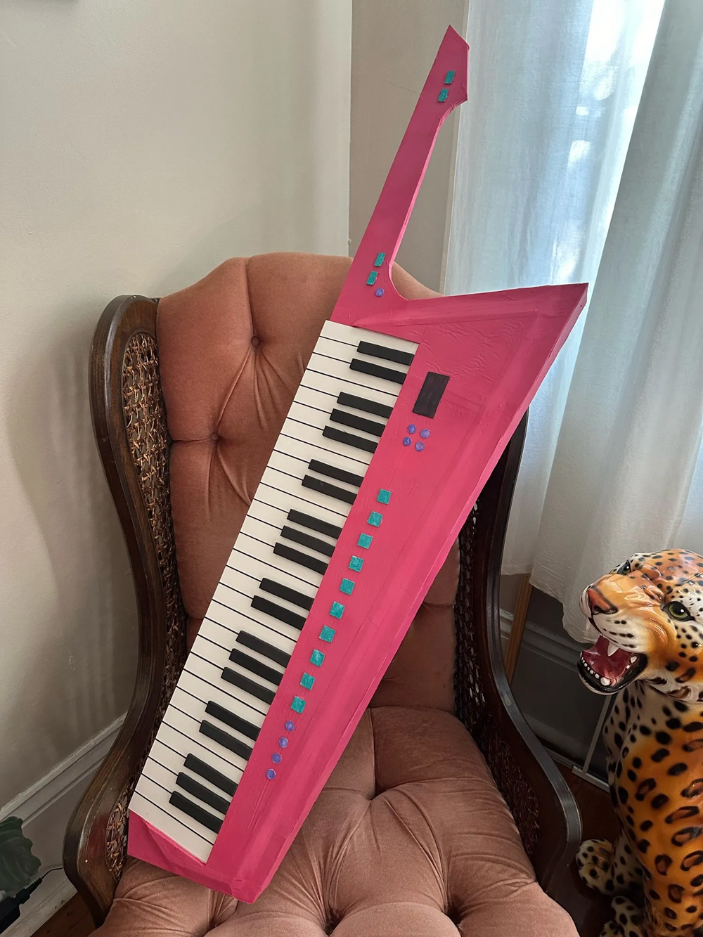 A pink keytar prop; looks pretty real!