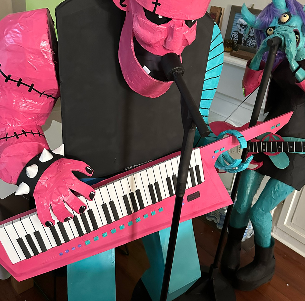 My Frankenstein statue holding the keytar prop like he's playing it.