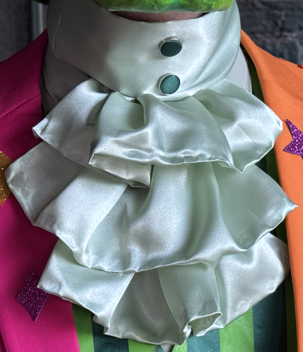 Close up of the pale green jabot.
