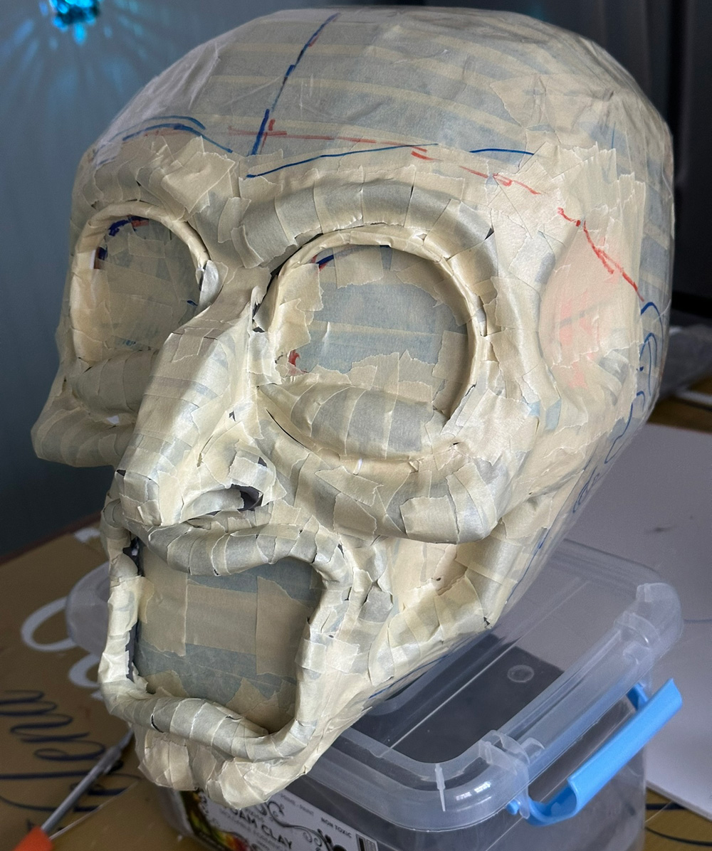Covering the facial features with masking tape