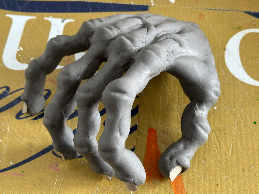 Gray foam clay covering the hand shape