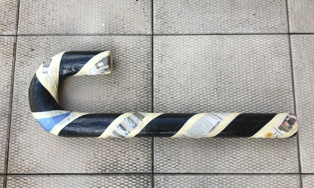 Making giant candy canes - masking stripes with newspaper