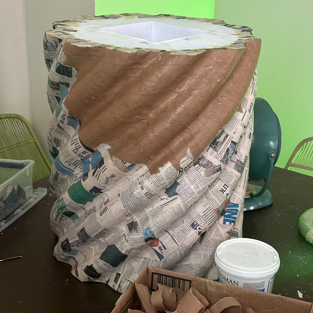 Paper mache covering the column shape.