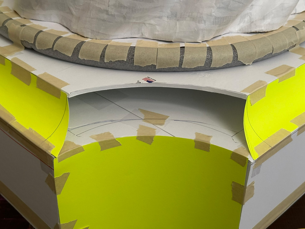 Close up of the concave curved corners of the square base.
