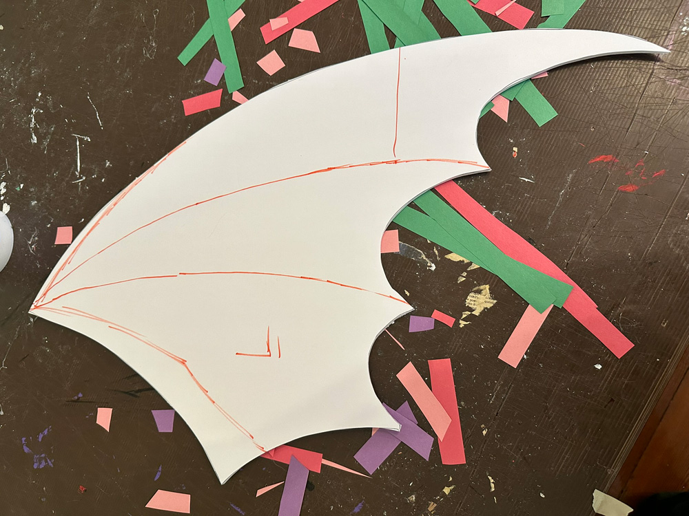 Cutting out the wing shape from foam board