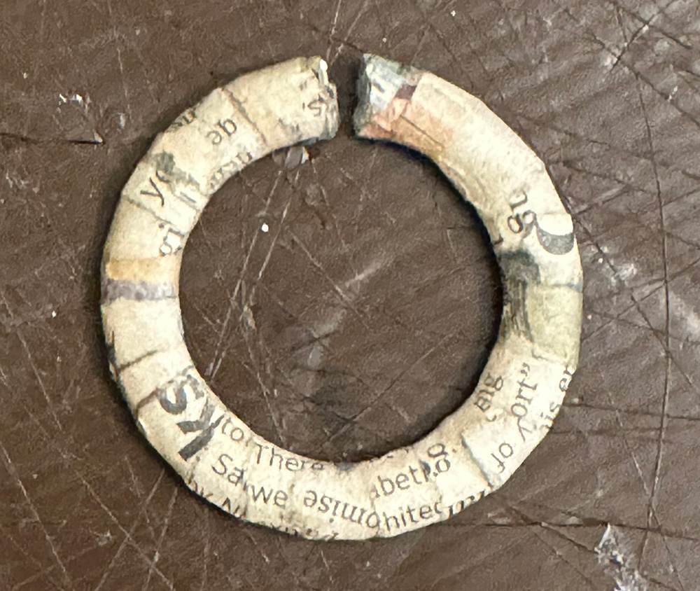 The nose ring; a large ring covered in newspaper