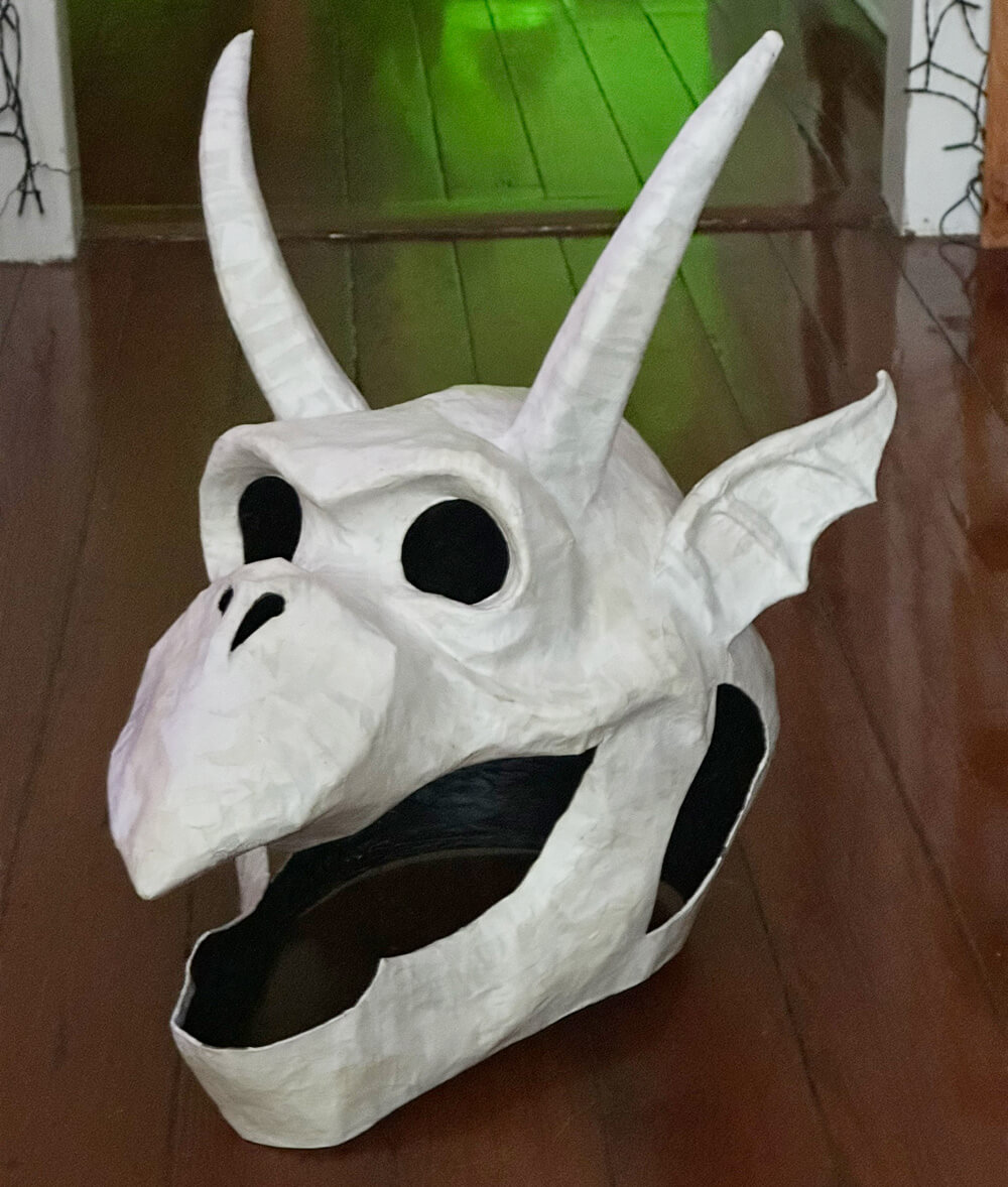 The gargoyle mask now with horns and ears, covered in white paper mache.
