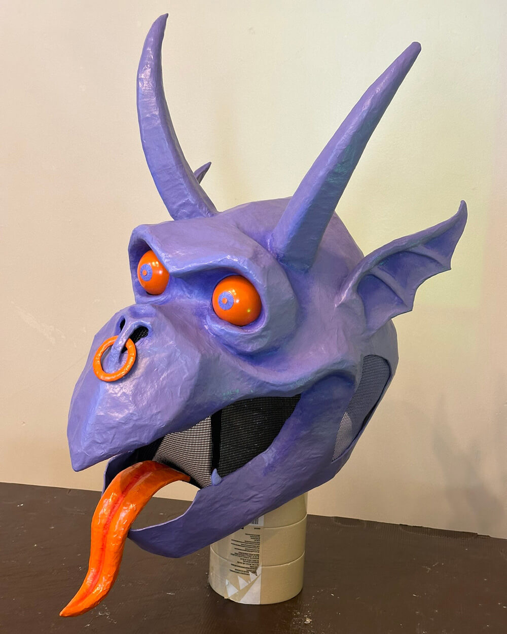 Three-quarter view of the finished gargoyle mask.