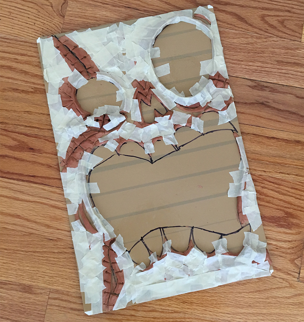 Haunted book sculpture - masking tape to smooth the edges