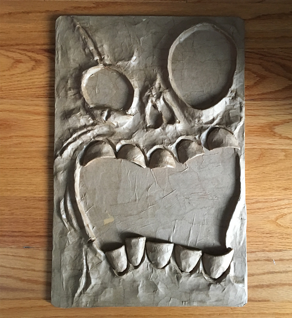 Haunted book sculpture - paper mache