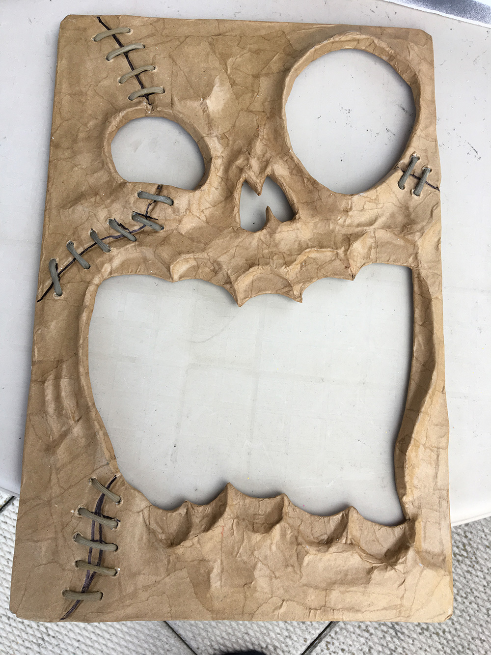 Haunted book sculpture - cutting out the face