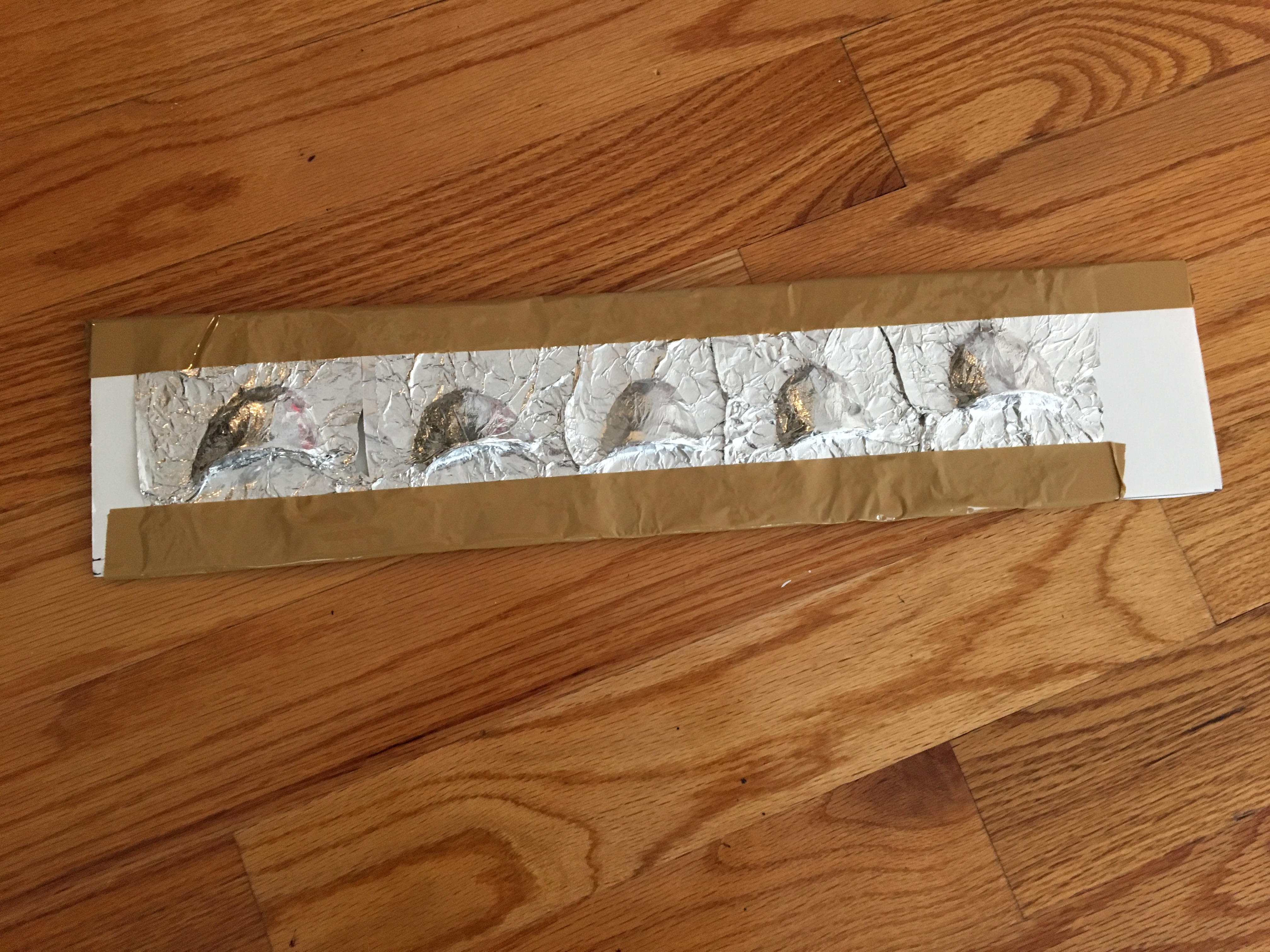 Haunted book sculpture - aluminum foil on the teeth