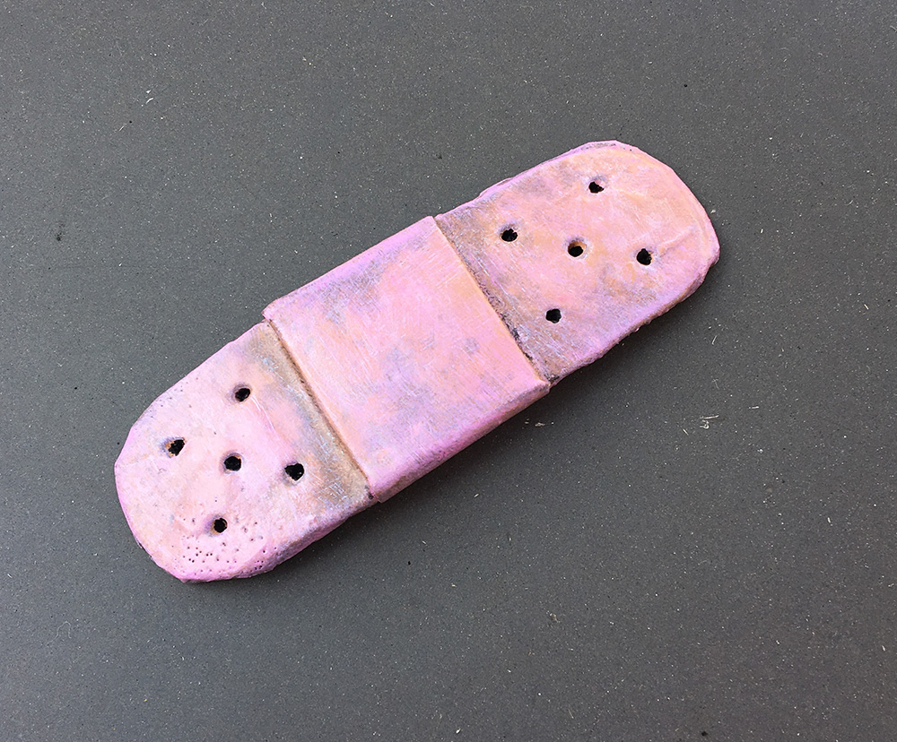 Necronomicon sculpture - painting the bandaid